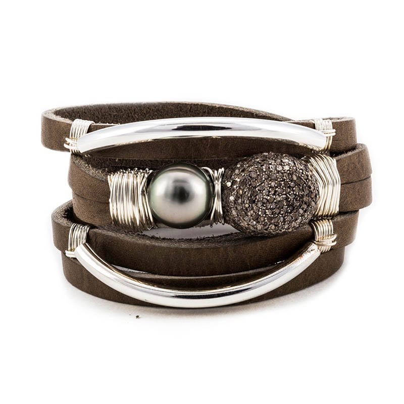 A leather wrap bracelet with pearl to demonstrate the type of jewelry used in leather care. 