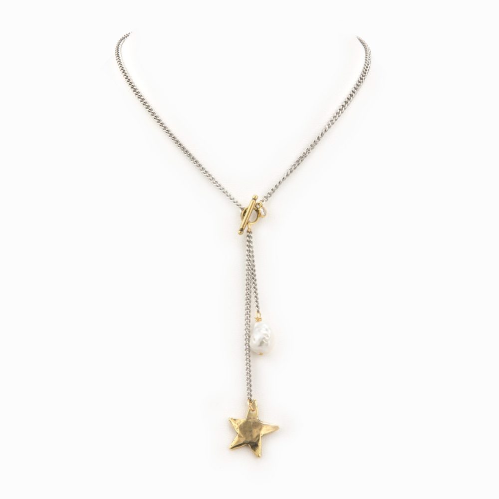 A flat silver short chain necklace with gold star and white baroque pearl drop.