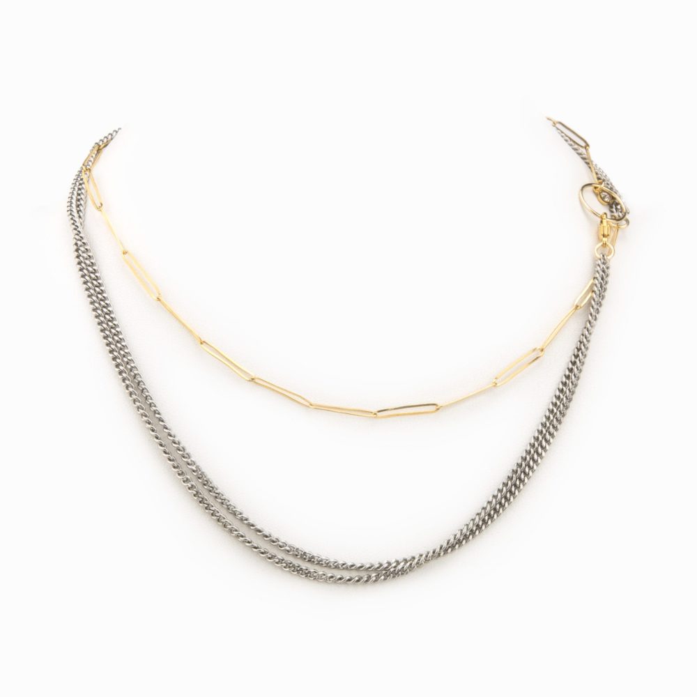 A necklace with an oxidized sterling silver flat chain and 14k gold-filled paperclip chain.