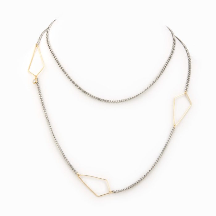 A simple and delicate necklace with a flat oxidized sterling silver chain with 14K gold-filled diamond geometric detail.
