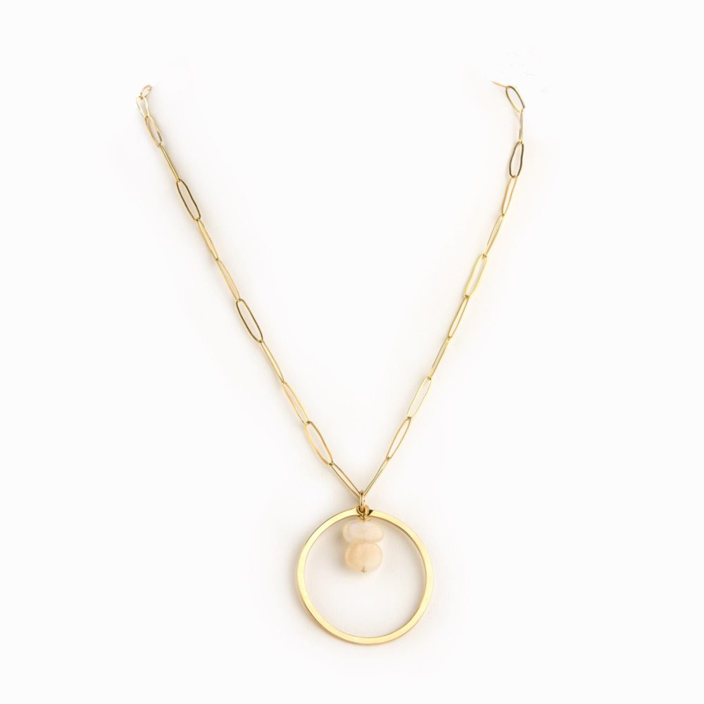 A 14k gold filled paperclip chain necklace with circle charm and moonstone.