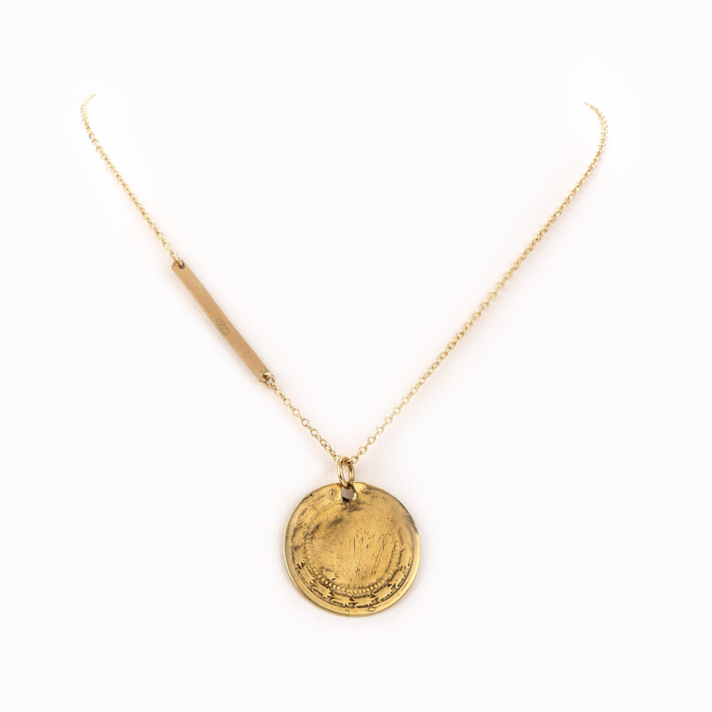 Delicate 14k gold chain necklace with a gold bar and gold stamped coin.