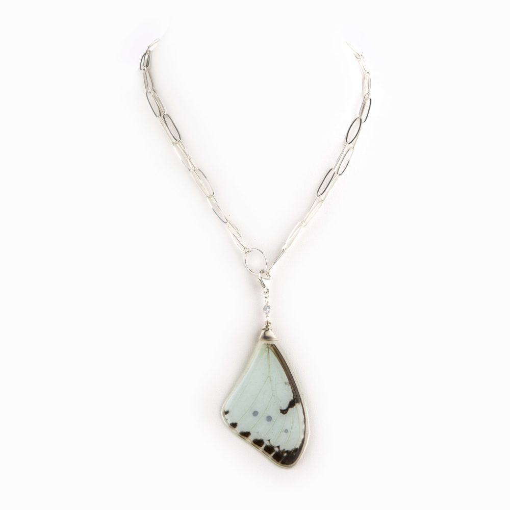 A delicate and thin sterling silver paper clip chain with light blue butterfly wing charm.