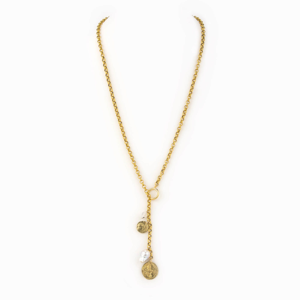 A solid brass rolo chain necklace with an oversized clasp worn long and finshed with a large baroque pearl, small moon stone, and brass antique coin charms.