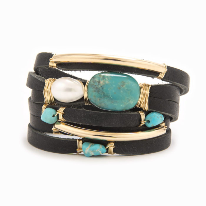 A black-colored leather wrap bracelet with wire wrapped in 14k gold fill tubes with scattered turquoise and fresh water pearls.