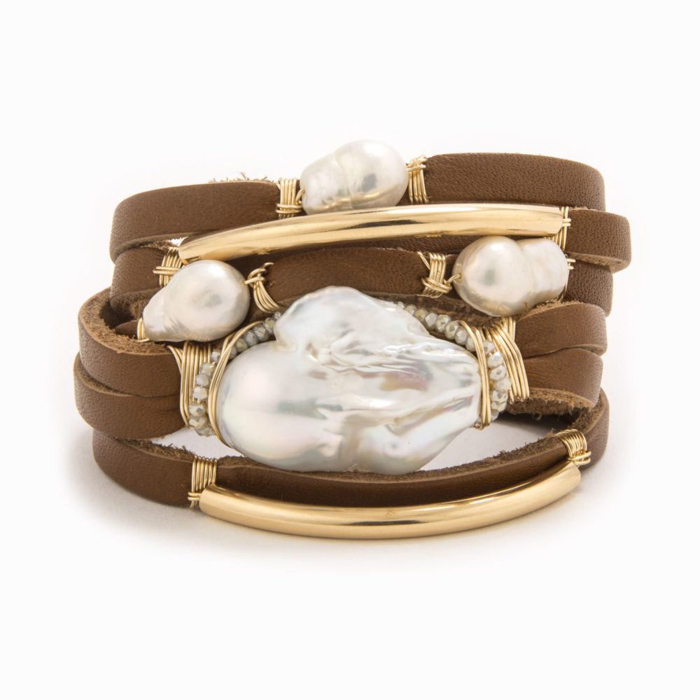 A brown-colored leather bracelet with wire wrapped in 14k gold fill tubes with scattered baroque and fresh water pearls.