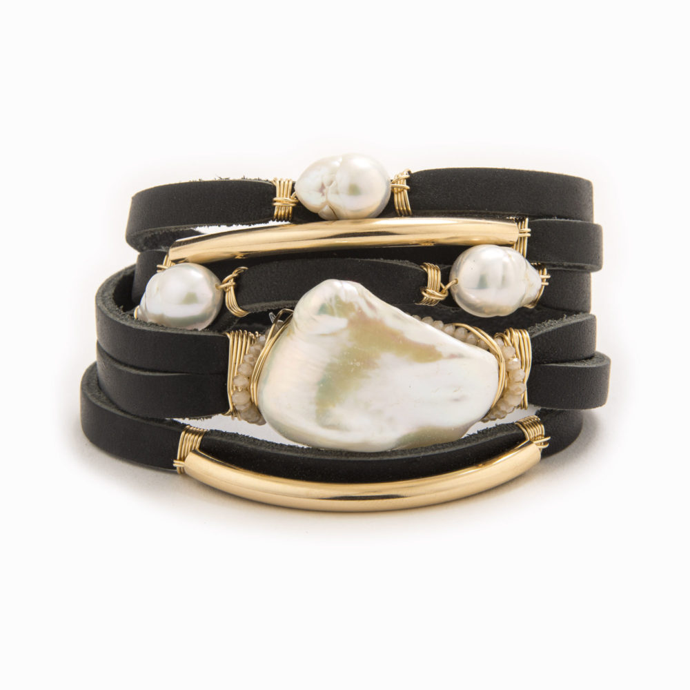 A black-colored leather wrap bracelet with wire wrapped in 14k gold fill tubes with baroque and fresh water pearl.