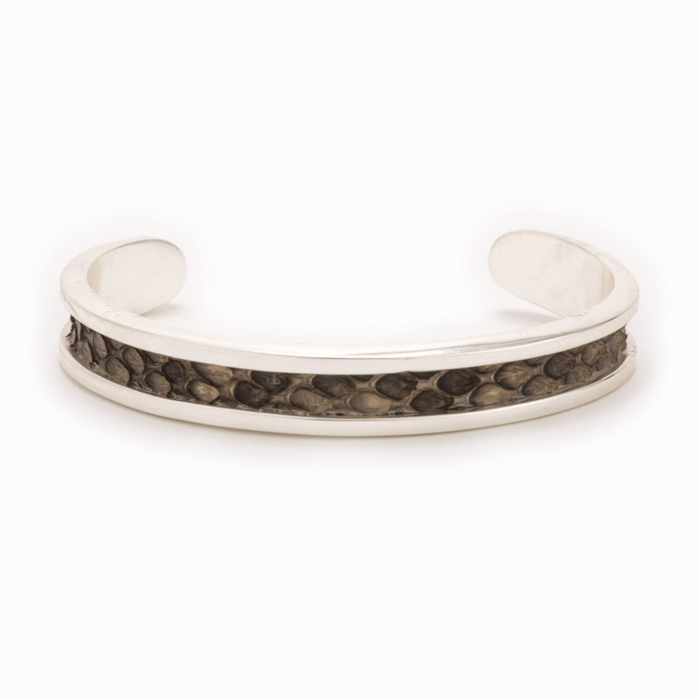 A small silver cuff with grey and brown colored snake pattern inlay.A small silver cuff with grey and brown colored snake pattern inlay.