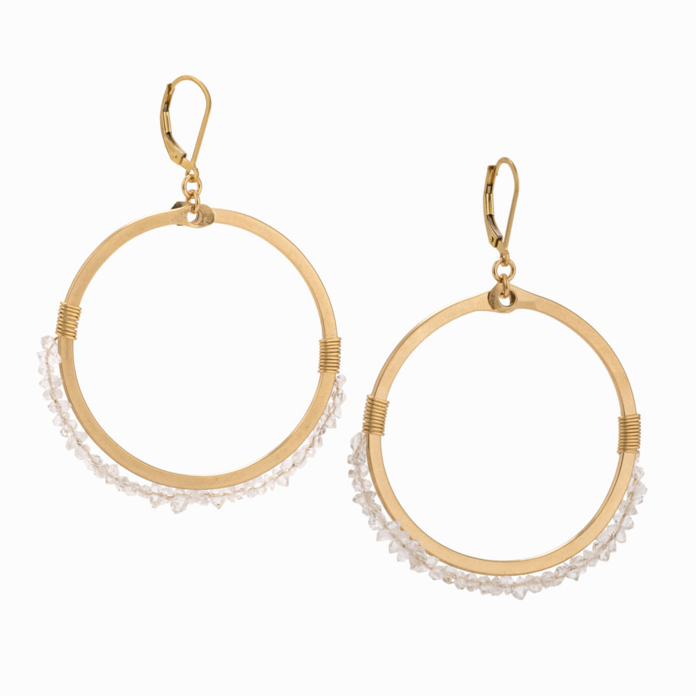 A pair of 14k gold-filled hoop earrings with wire-wrapped Herkimer crystals.