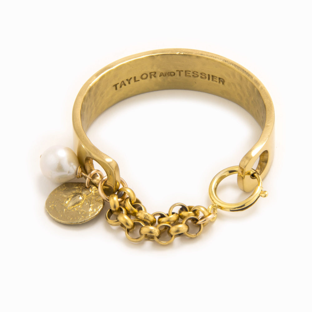 Adjustable cuff in solid brass with a gold coin, baroque pearl and lobster claw closure.