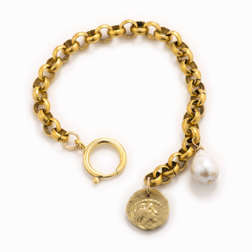 An adjustable, brass rolo chain bracelet with a coin and baroque pearl.