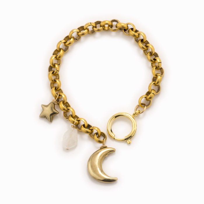 An adjustable, brass rolo chain bracelet with moonstone and gold moon and star.