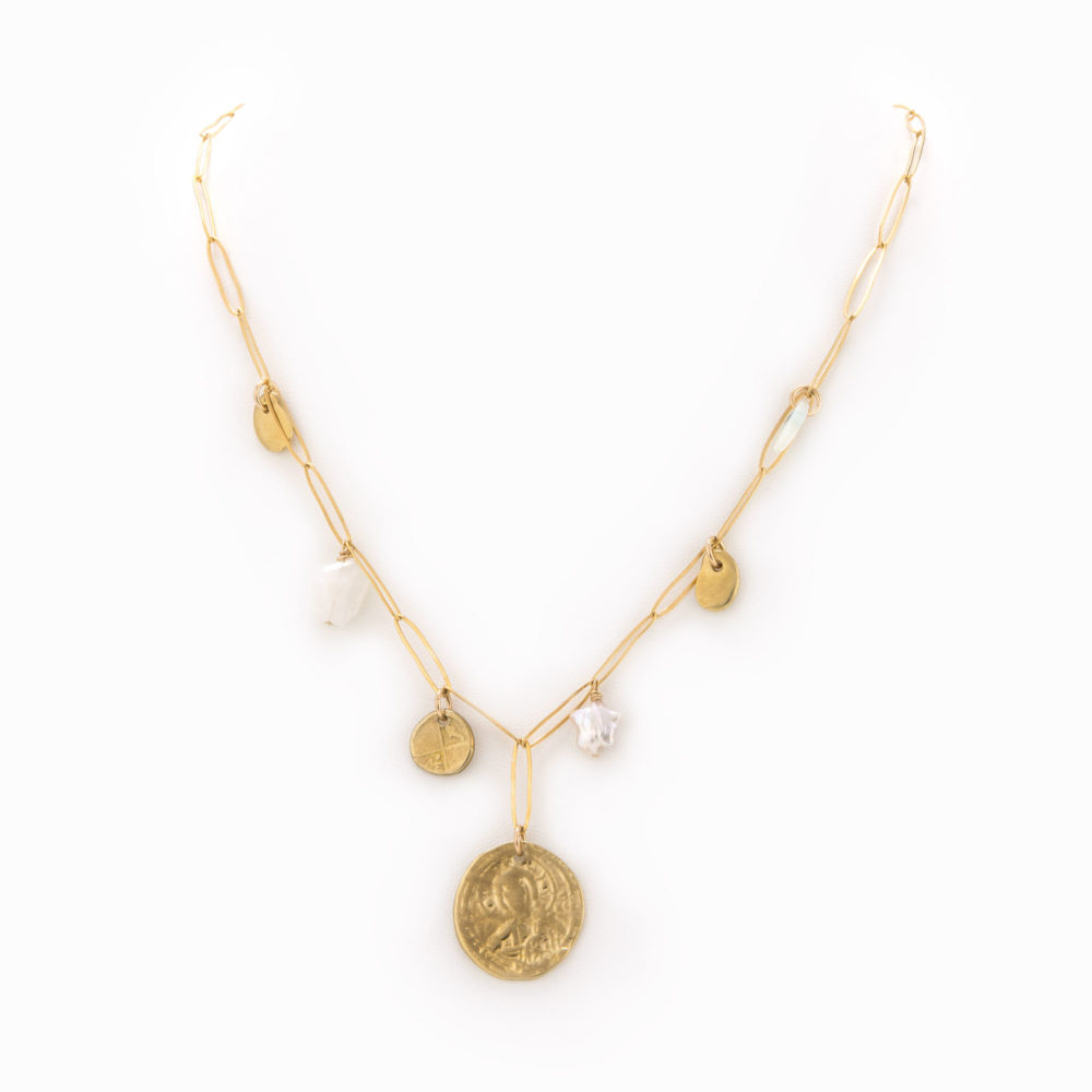 A 14k gold-filled paperclip chain necklace with brass coins, moonstone and pearl charms.