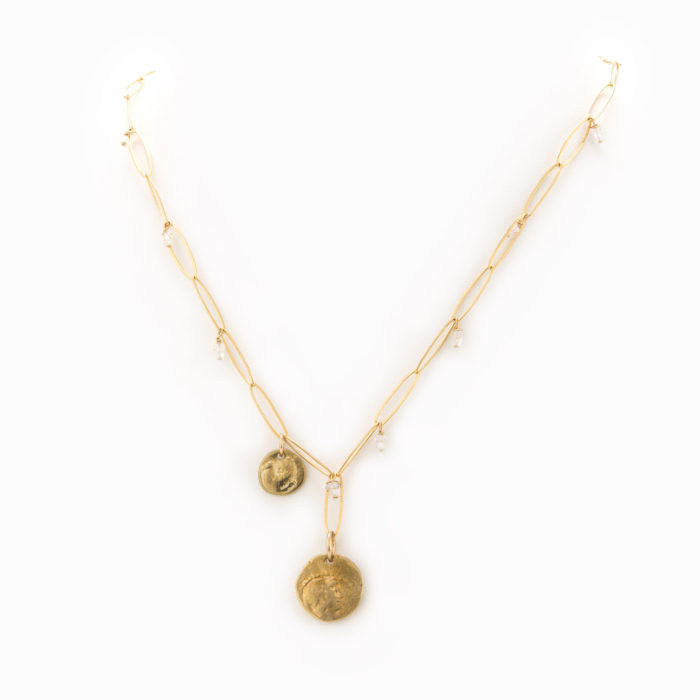 A necklace with 14k gold filled paperclip chain, stamped brass coins, and crystals.