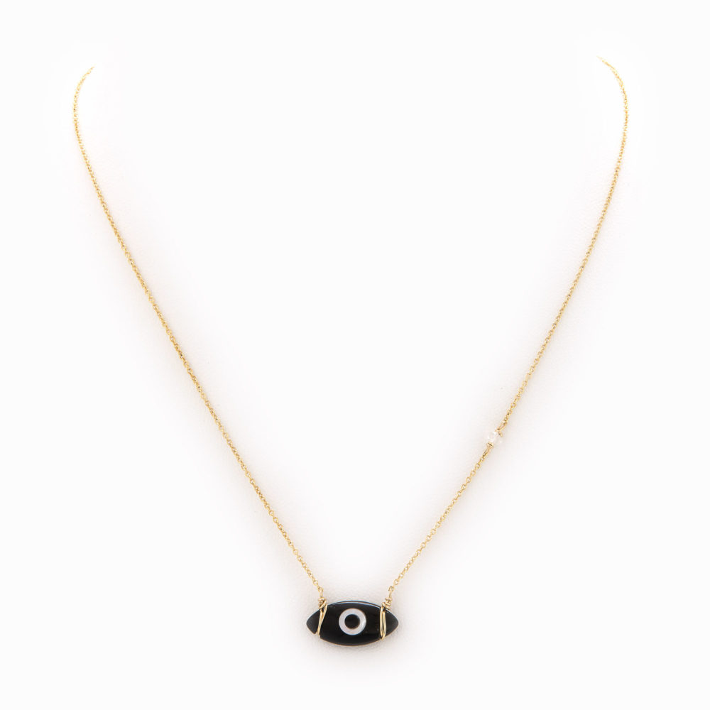 A delicate necklace with 14k gold fill chain and black onyx evil eye charm.