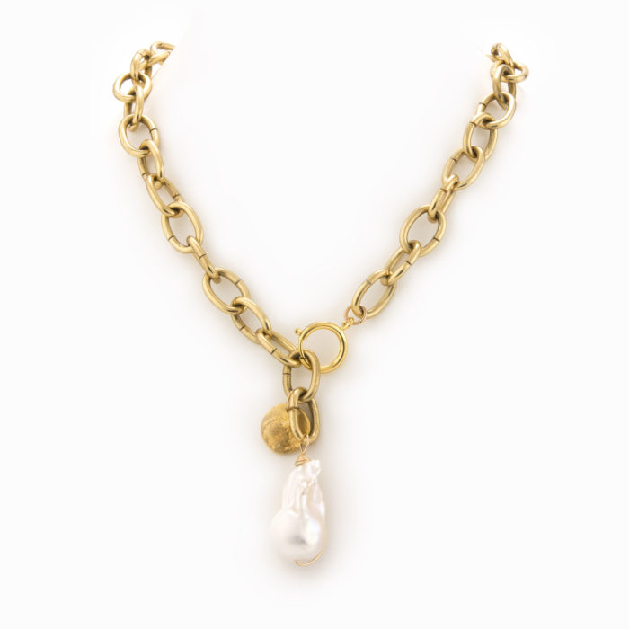 A thick brass chain necklace with a brass coin and a large baroque pearl.