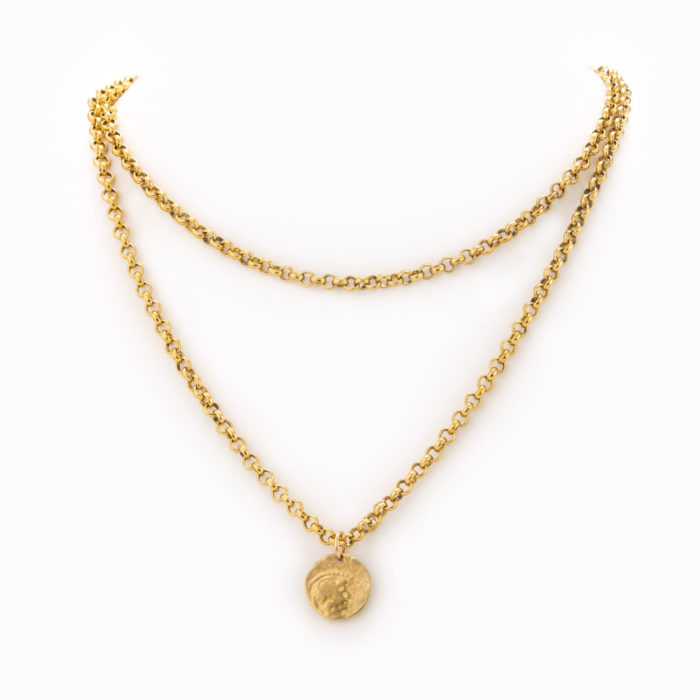 A layered necklace with solid brass rolo chain, double-wrapped and finished with antique brass coin.