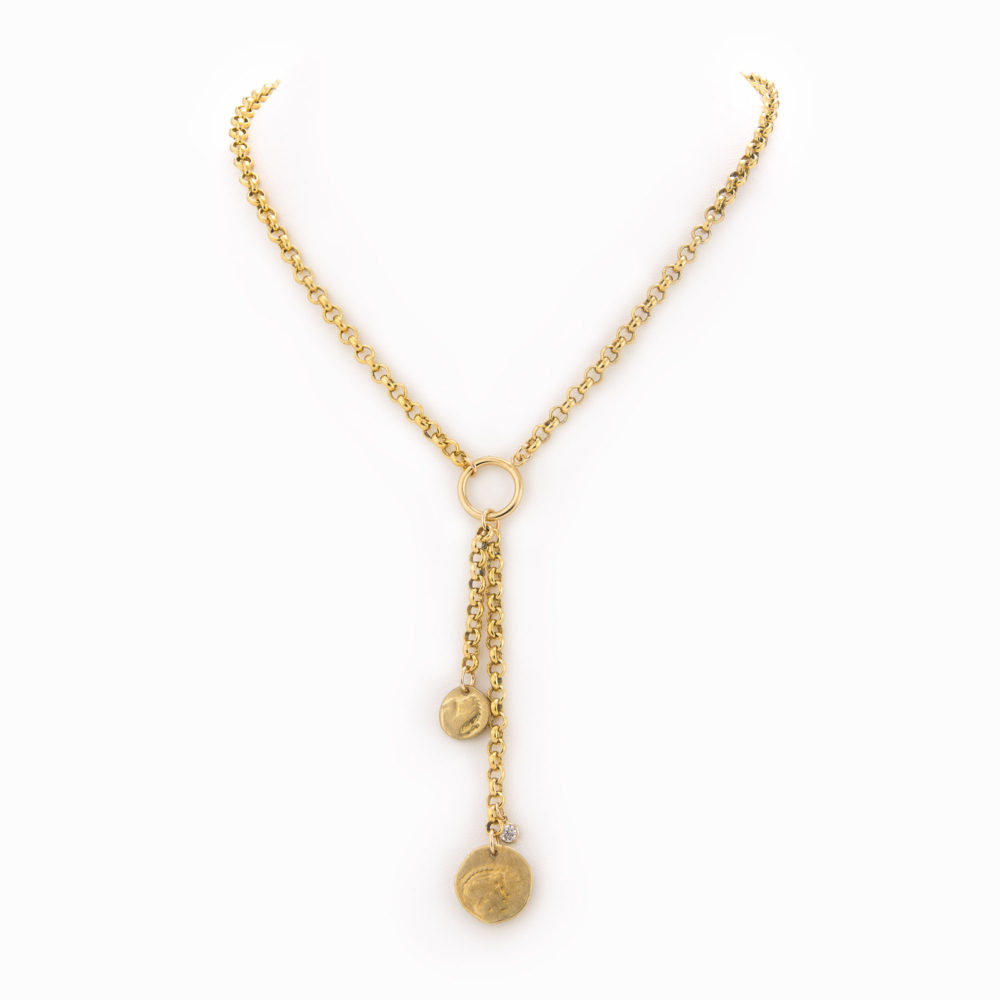 A brass rolo chain necklace with 2 chain drops, each finished with a brass coin.
