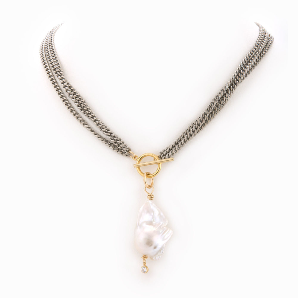 24" necklace with a sterling silver chain, 14k gold filled front closure and baroque pearl.