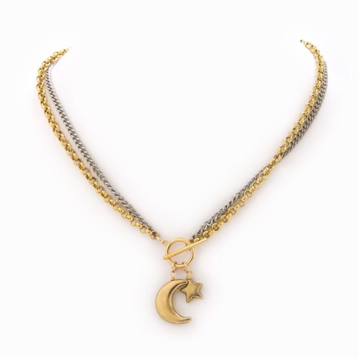 A flat oxidized sterling silver chain and brass rolo chain necklace with a 14k gold-filled front closure and brass star and moon charms.