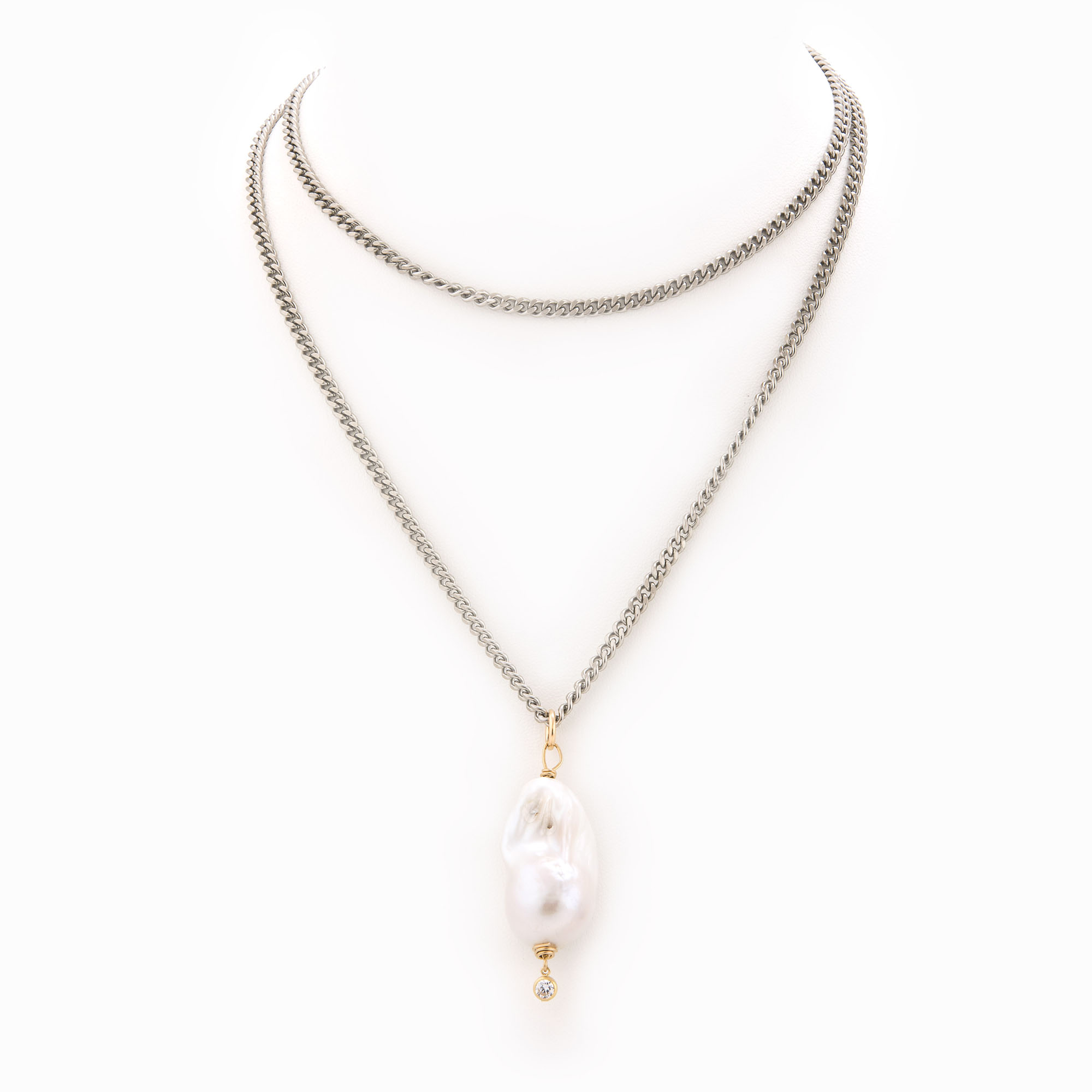A flat oxidized sterling silver chain necklace with 14k gold-filled accents, baroque pearl and crystal bezel detail.