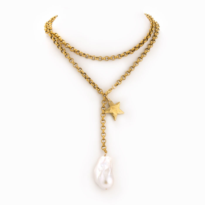 A large brass chain necklace with large baroque pearl and brass star.