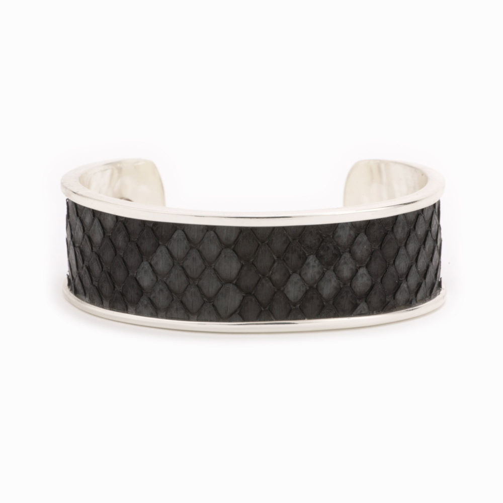 Front view of a medium silver cuff with charcoal colored snakeskin pattern inlaid.