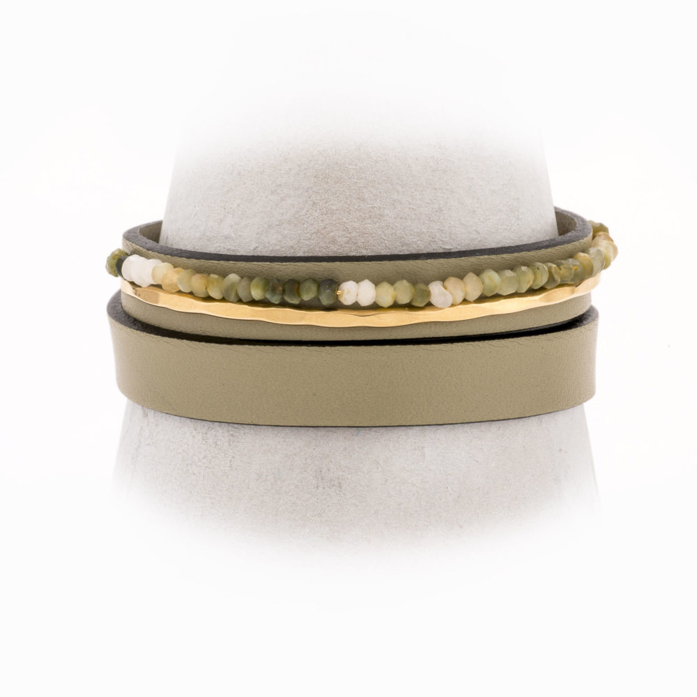 Front view of an adjustable, taupe leather wrap bracelet with 14k gold-filled wire and moss agate.