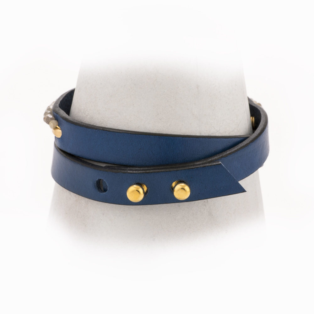 An adjustable, navy leather wrapped bracelet with 14k gold-filled hand-forged wire and labradorite.