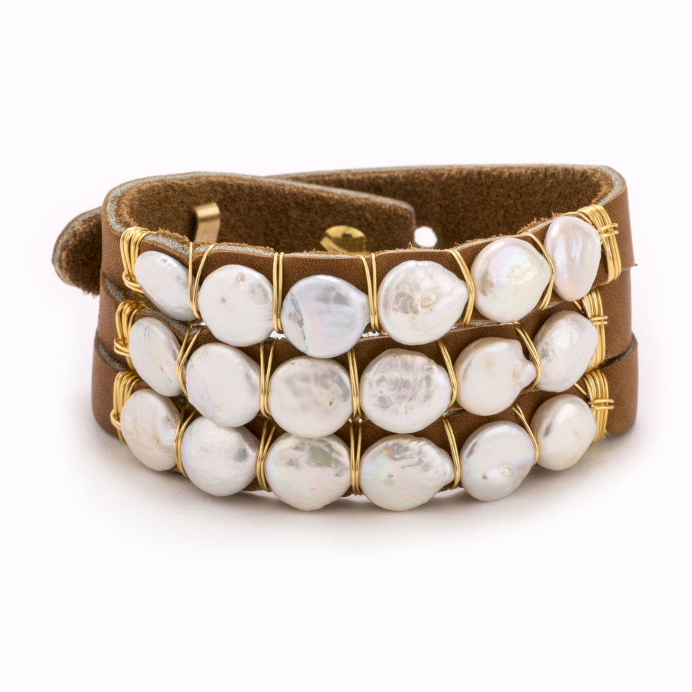 Front view of an adjustable tan leather bracelet with 14k gold wire wrapped freshwater pearls.