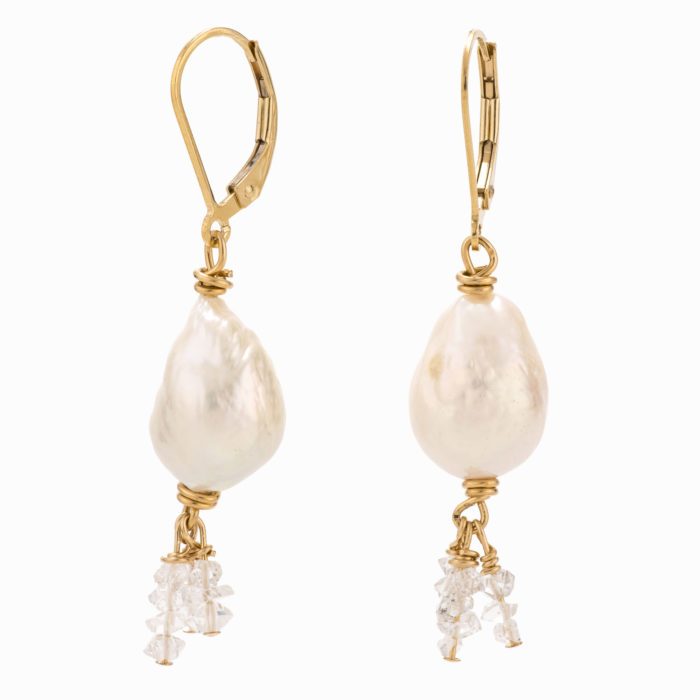 A pair of white pearl earrings with 14k gold-filled backs and Herkimer quartz.