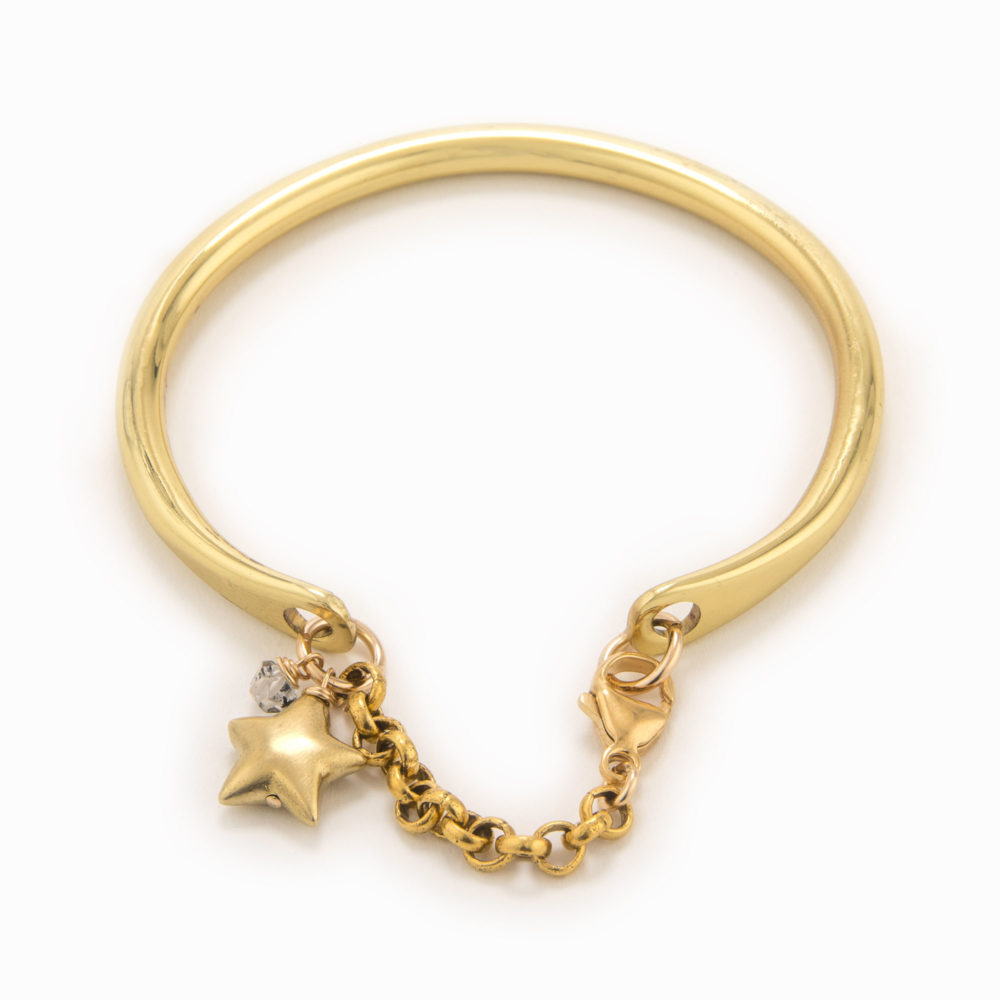 A brass cuff with rolo chain, Herkimer quartz and brass star charm.