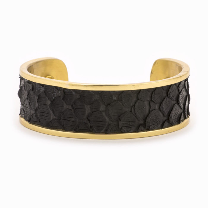 A medium gold cuff with black colored snakeskin pattern inlaid.