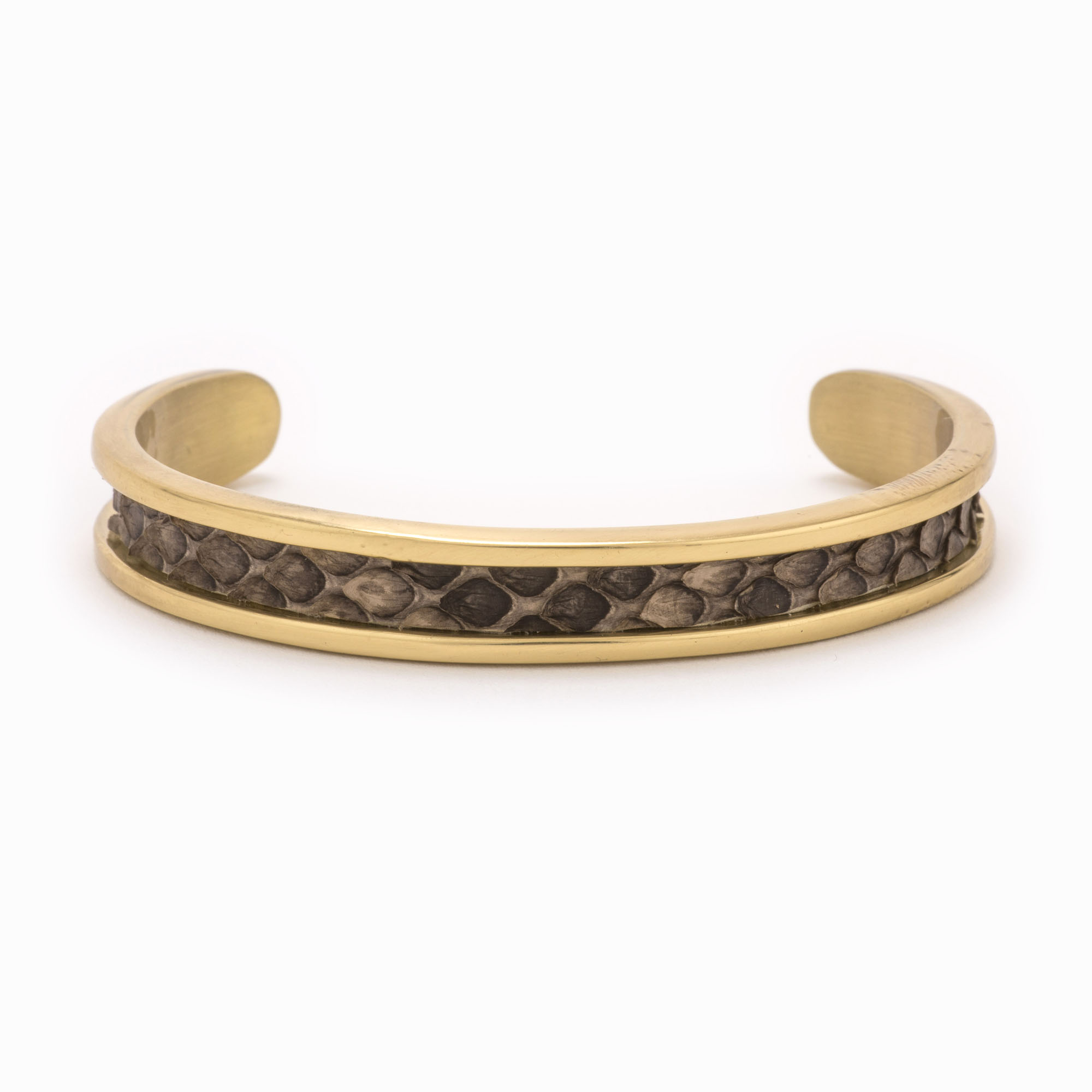 Small gold cuff and with a brown and grey snakeskin pattern.