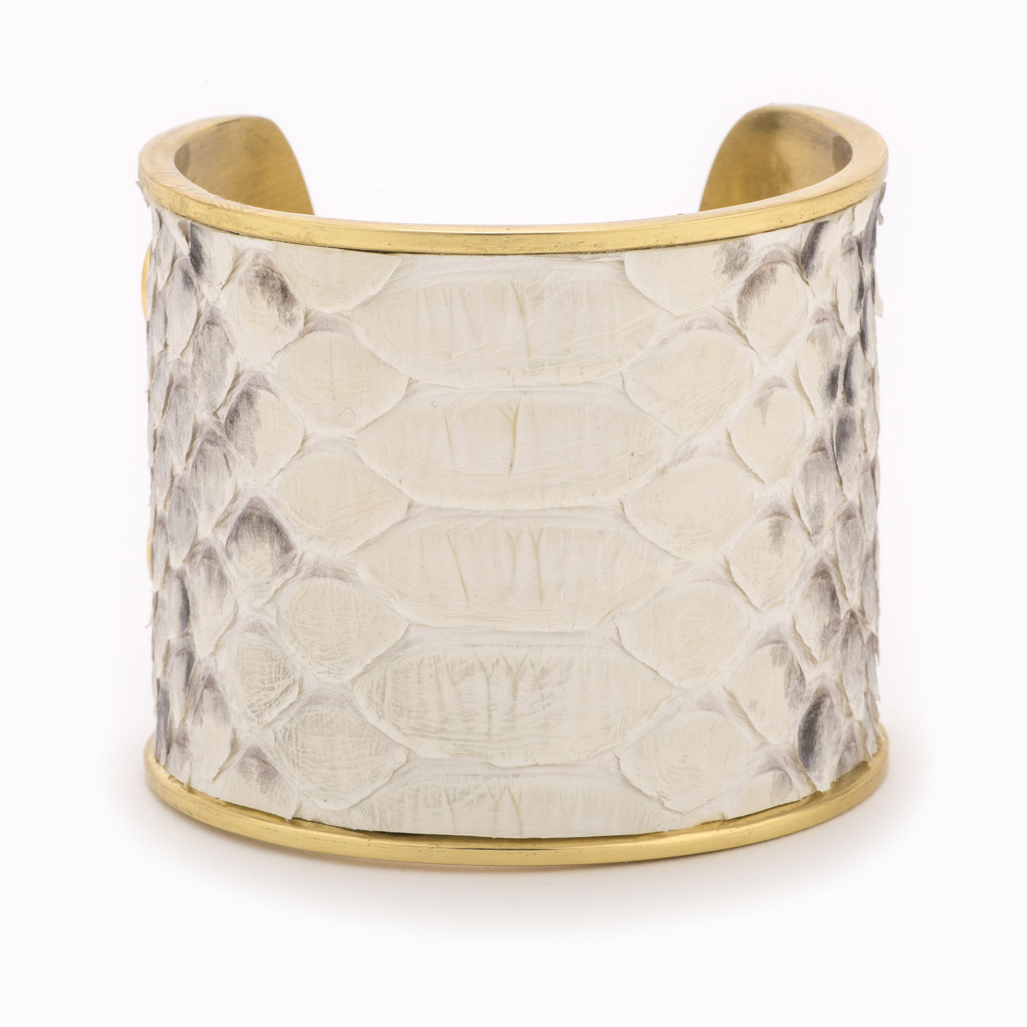 Large gold cuff with a black and white python pattern.