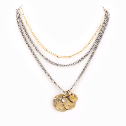 A multi-layered mixed metal chain necklace completed with multiple antique brass coins and a bezel.