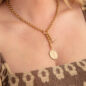 brass chain rolo necklace, lifestyle image.
