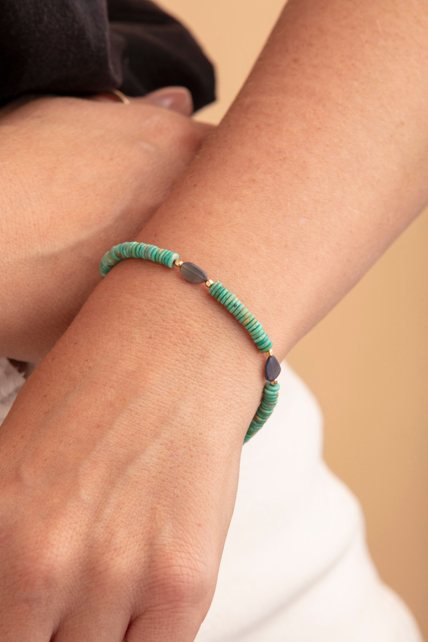 Celestial Harmony Bracelet. An exquisite bracelet showcasing vibrant turquoise beads and stunning opal accents.